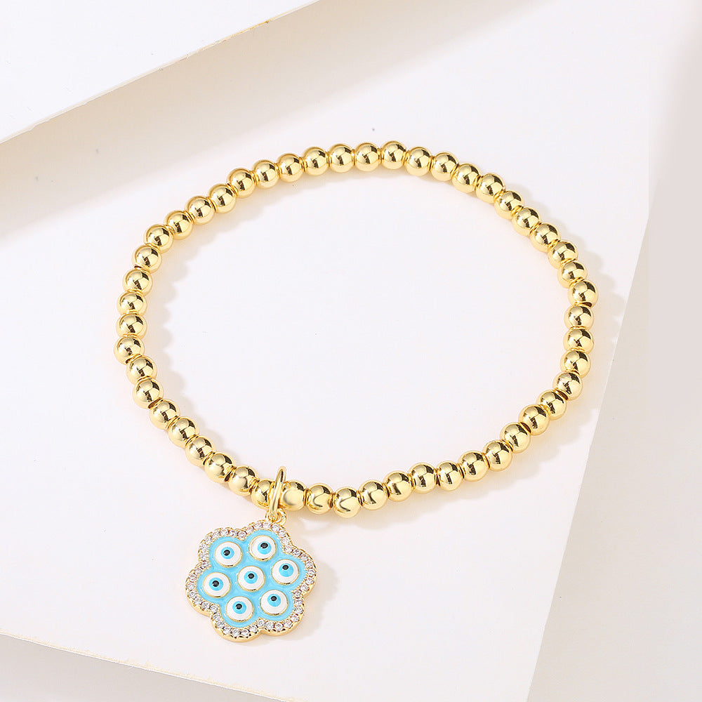 Halo Flower Pendant Golden Bead Bracelet