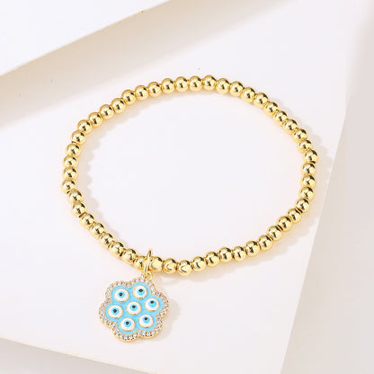 Halo Flower Pendant Golden Bead Bracelet