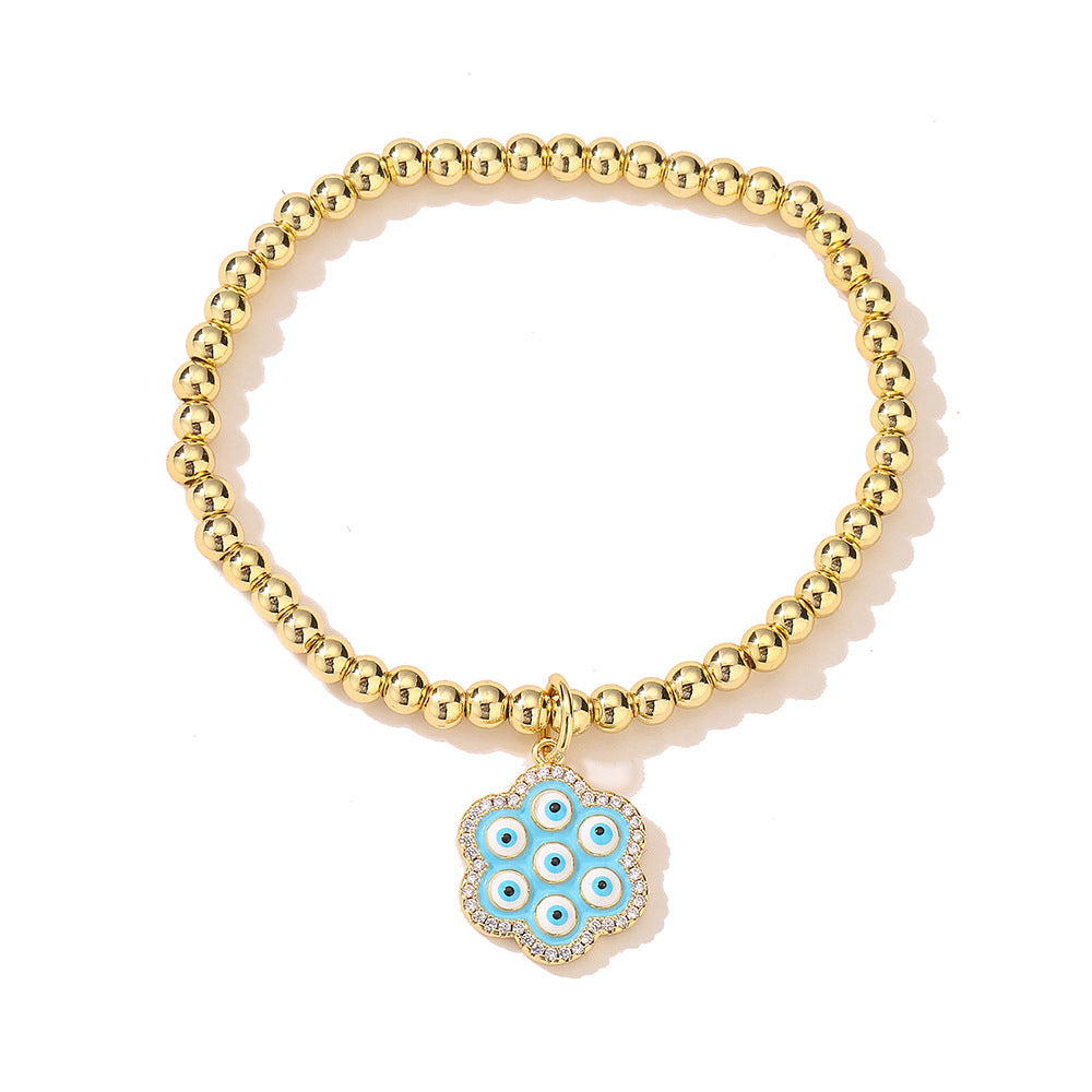 Halo Flower Pendant Golden Bead Bracelet