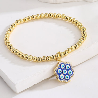 Halo Flower Pendant Golden Bead Bracelet