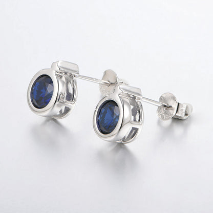 White Gold Round Stud Earrings With Blue Sapphire