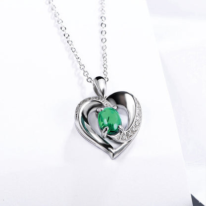 Sterling Silver Channel Setting Hollow Heart Shape Pendant with Oval Brilliant Cut Emerald Gem