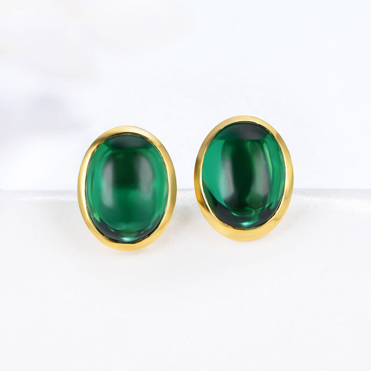 Golden Stud Earrings With Oval Emerald Gem